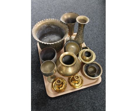 A tray of assorted brass ware to include Eastern brass planter and vases, pair of candlesticks, bowls etc 