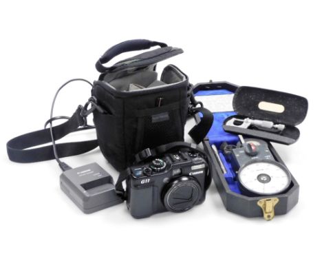 A Canon G11 digital camera, with a 5x IS lens, together with a Venture Tachometer, cased.