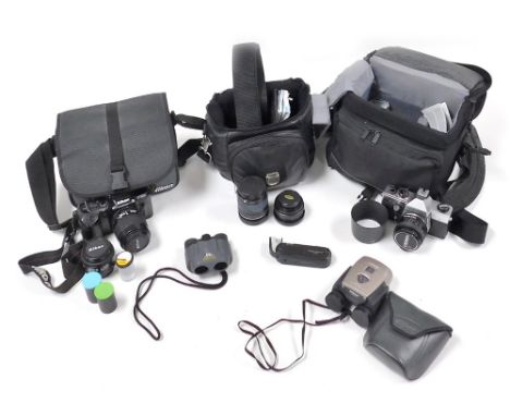 A group of camera related equipment, to include a Praktica MTL 5 camera, Pentax 8x21 binoculars 294020, Nikon binoculars, len