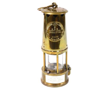 A Protector Lamp and Lighting Company Limited miner's safety lamp, type 6, N and O, with plaque to base ''Presented to Mr T C