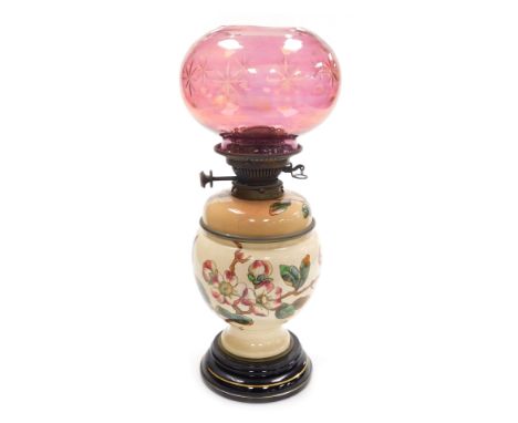 A late 19thC Benetfink &amp; Company Hink's 2 duplex pottery oil lamp, decorated with butterflies and apple blossom, raised o