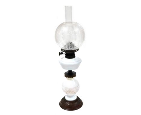 A Victorian milk glass and metal oil lamp, by James Hinks and Sons, with a chimney and etched clear glass shade, 66cm high.