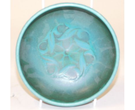 A Pilkingtons Royal Lancastrian pottery bowl, decorated with floral and foliate motifs against a blue ground, artist initials