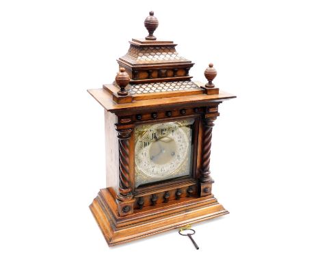 A late 19thC mahogany cased mantel clock, the brass Arabic numeral face with silvered chapter ring, foliate spandrels and eig