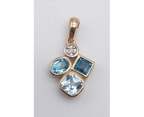 A 9 K yellow gold pendant with topaz and diamond. Weight: 1.3 g. 