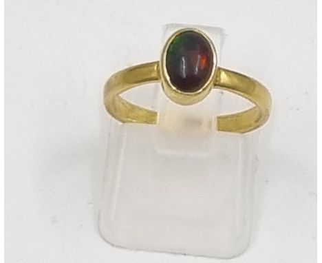 A Yellow Metal and Black Opal Solitaire Ring. Size K. 1.85g 