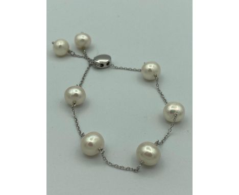 SILVER and freshwater PEARL SLIDER BRACELET, consisting seven cultured pearls on a fine silver bracelet with slider adjustmen