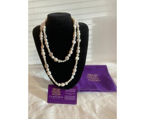 Freshwater cultured PEARL NECKLACE  having round and flat cultured pearls. New and unworn complete with original authenticity