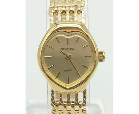 A Ladies Sekonda Gilt Watch. Ladder-Link strap with a heart-shape case-15mm. Quartz movement but needs battery. In very good 