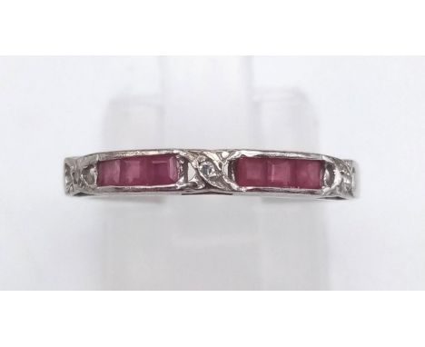 A 14 K white gold ring with diamonds and rubies. Ring size: K1/2, weight: 1.3 g. 