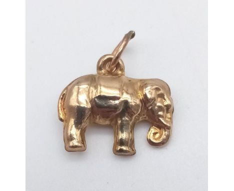 A 9 K yellow gold elephant charm. Weight: 0.7 g. 