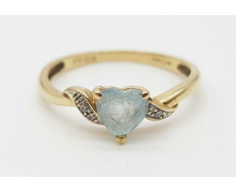 A 9K Yellow Gold  Diamond &amp; Topaz heart Ring. Size K, weight 1.4 grams. 