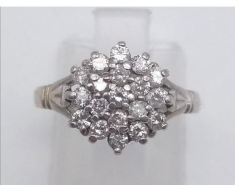 An 18 K white gold ring with a diamond cluster (0.5 carats), Ring size: L, weight: 3.5 g. 