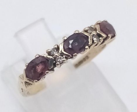 A 9 K yellow gold ring with diamonds and rubies. Ring size: K 1/2, weight: 1.8 g. 