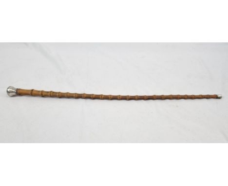 A SILVER TOPPED AND TIPPED BAMBOO SWAGGER STICK CICA 1910.  67cms long 