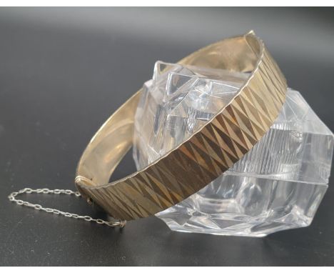 A Vintage Silver Gilt Bangle. Geometric pattern design. London 1970 hallmark. 6cm diameter. 31g. 