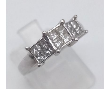 A 9 K white gold ring with diamonds (0.5 carats) arranged in three square clusters. Ring size: M1/2, weight: 3.3 g. 