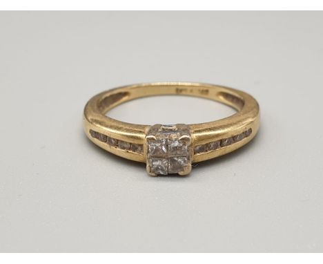 An 18K Yellow Gold Diamond Cluster Ring. Size K. 3g.0.25ct diamonds. 