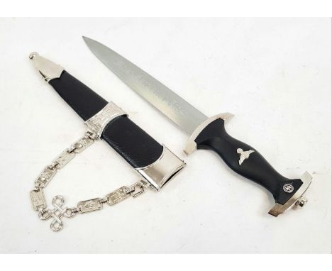 A Reproduction Nazi Dagger. SS markings on handle. Scabbard with decorative chain. 21cm blade length. 
