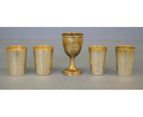 Four German 800 silver shot cups & 1 other comprising of a pair of German 4cm high, 2 singles and a footed cup hallmarked Bir