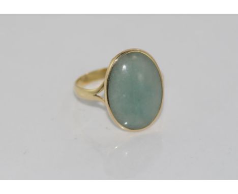 14ct yellow gold and jade ring total weight: approx 3.7 grams, size: S-T/9 (stamped 14K , tested 14ct)