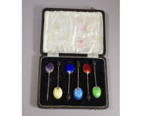 Cased set of 6 silver gilt & enamel coffee spoons hallmarked Birmingham (William Suckling Ltd), one coffee bean finial missin