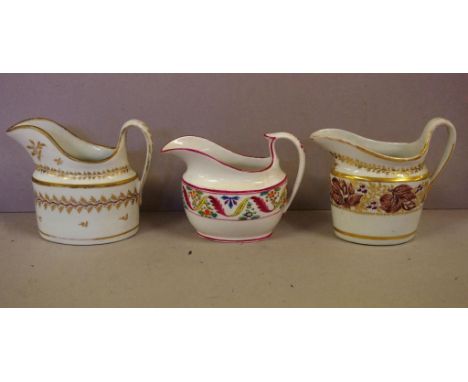 Three New Hall type creamers (two helmet shaped), 11.5cm high (tallest) approx.