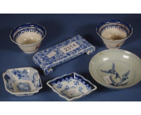 Five Chinese blue and white assorted dishes together with a blue and white floral porcelain stand. Rim chips to the blue rimm