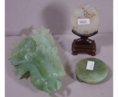 Good Chinese white jade carved plaque on a timber stand, together with a carved green stone belt buckle and a carved green st