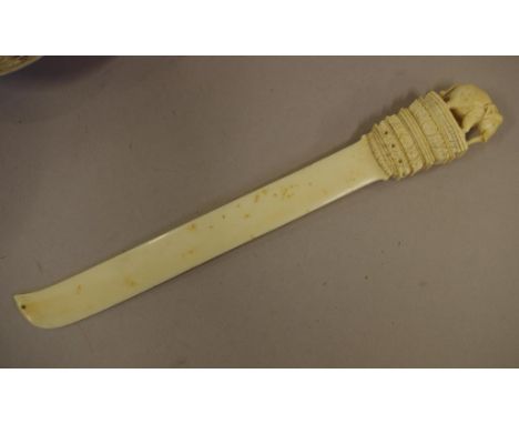 Antique ivory page turner with carved elephant decoration, circa 1920s, 31cm long approx. NB This item may not be exported wi