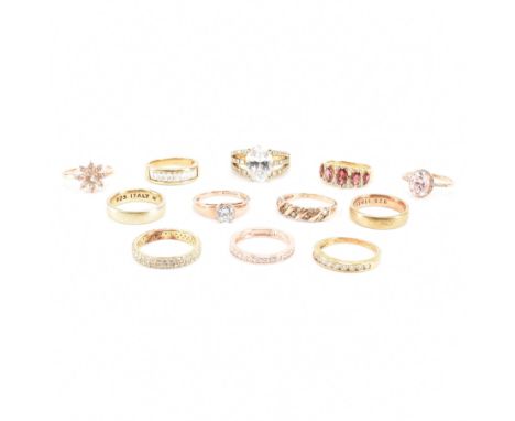 An assorted collection of 925 silver gold tone rings. The lot to include; gilt rose gold tone cubic zirconia solitaire engage