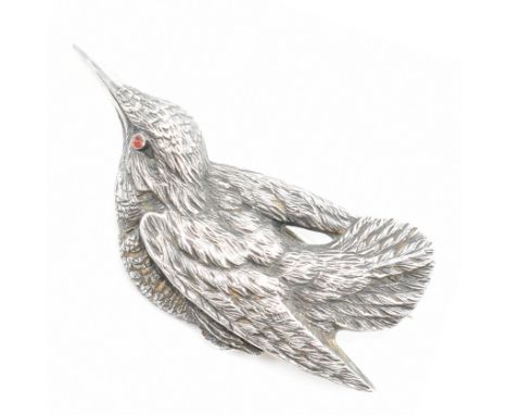 A 19th Century Victorian silver mourning brooch in the form of a bird. The bird having moulded details with a red stone caboc