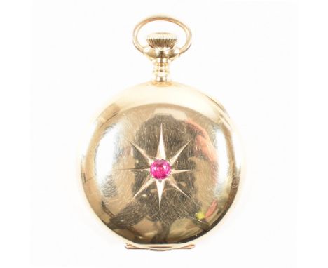 A vintage 14ct gold and ruby Elgin full hunter pocket watch. The watch having a round cut ruby to the centre of the exterior 