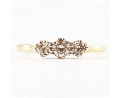 A hallmarked 18ct gold and diamond three stone ring. The ring bring set with three round brilliant cut diamonds. Diamonds est