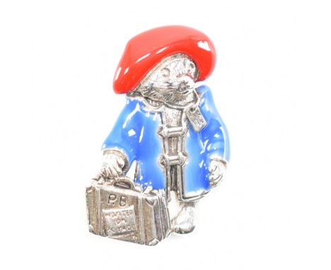 A sterling silver enamelled Paddington bear brooch pin. The brooch depicting Paddington bear with blue enamel raincoat &amp; 