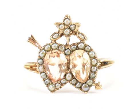 A Georgian antique gold topaz and seed pearl double heart ring. The ring being set with two pear cut topaz each surrounded wi