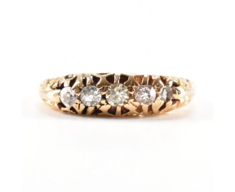 An Edwardian hallmarked 18ct gold and diamond ring. The ring set with five graduated diamonds to&nbsp; a scrolled gypsy setti