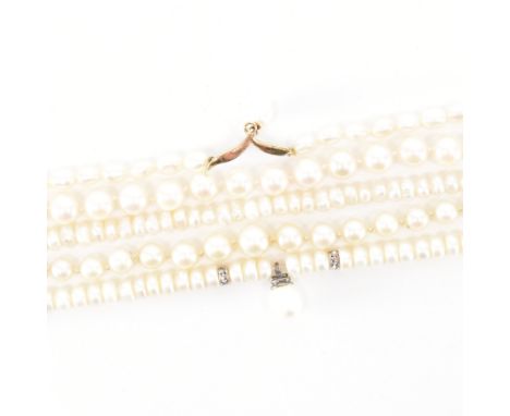 An assortment of antique and vintage pearl necklaces. The lot to include two button pearl necklaces (one with white metal fit