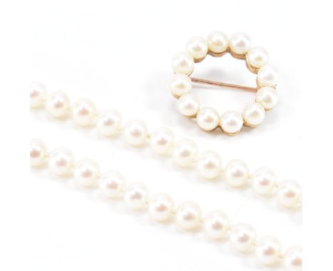 A hallmarked 9ct gold and cultured pearl roundel brooch pin together with a cultured pearl necklace.&nbsp; The brooch hallmar