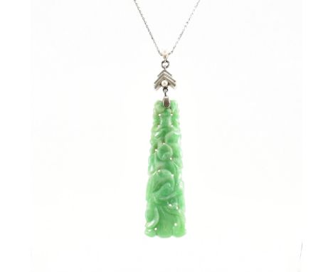 A vintage white gold, carved jade &amp; pearl set pendant necklace. The pendant of graduating trapeze form having a pierced &