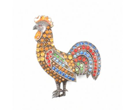 A 1930s Art Deco silver and coloured paste cockerel brooch. The brooch having orange enamelling to the head and coloured ston