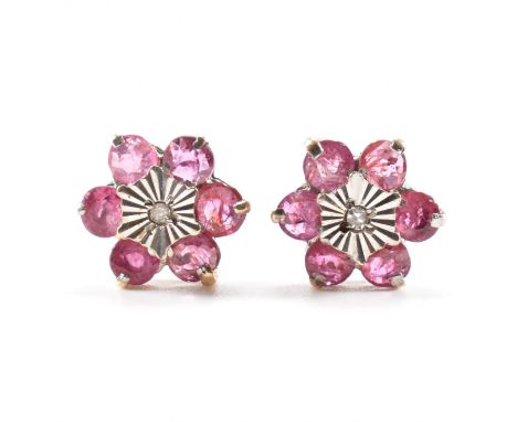 &nbsp;A pair of 9ct gold ruby and diamond cluster earrings. The earrings set with six round cut ruby set with a central star 