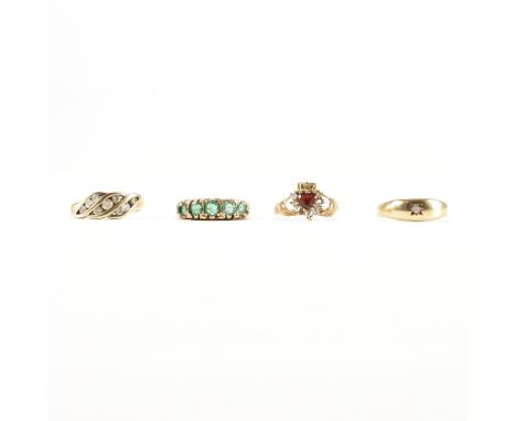 Four hallmarked 9ct gold gem set rings. To include emerald five stone ring, a CZ Cubic Zirconia cluster ring and gypsy ring, 