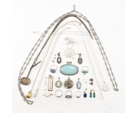 An assorted collection of silver jewellery. The lot to include; earrings, necklace pendants, chains, ingots, rings, simulated