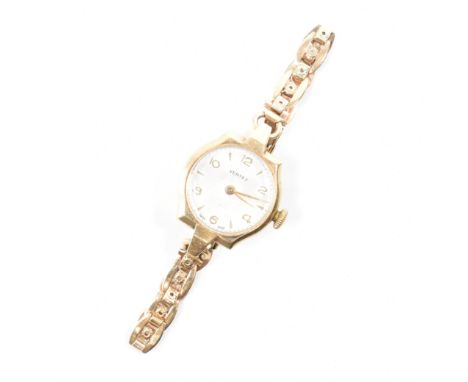 A vintage mid 20th Century hallmarked 9ct gold Vertex cocktail wrist watch. The watch having a round face with arabic and bat