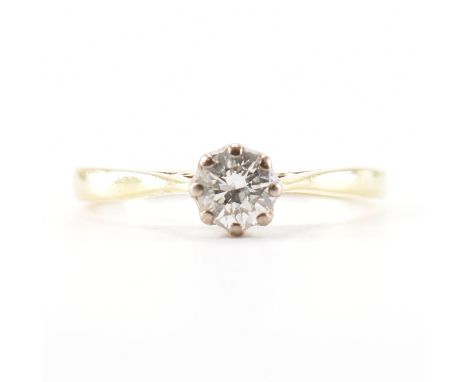 A hallmarked 18ct yellow gold &amp; diamond engagement style solitaire ring. The ring having a round brilliant cut diamond se