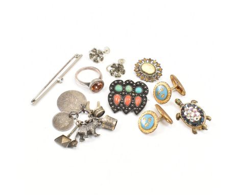 A collection of vintage silver and white metal jewellery. The jewellery to include a white metal charm group including bear h