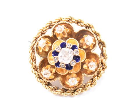 A 19th Century Victorian gold and diamond brooch pin. The brooch set with a central old cut diamond framed by smaller old cut