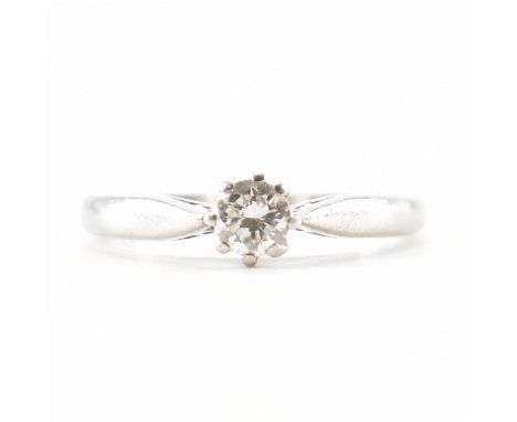 A hallmarked 950 platinum &amp; diamond engagement style solitaire ring. The ring having a central round brilliant cut diamon