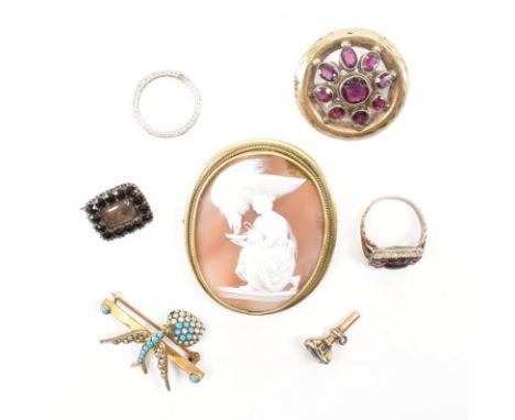 An assortment of antique jewellery. The lot to include a carved shell Hebe and the eagle cameo brooch, a purple paste stone s